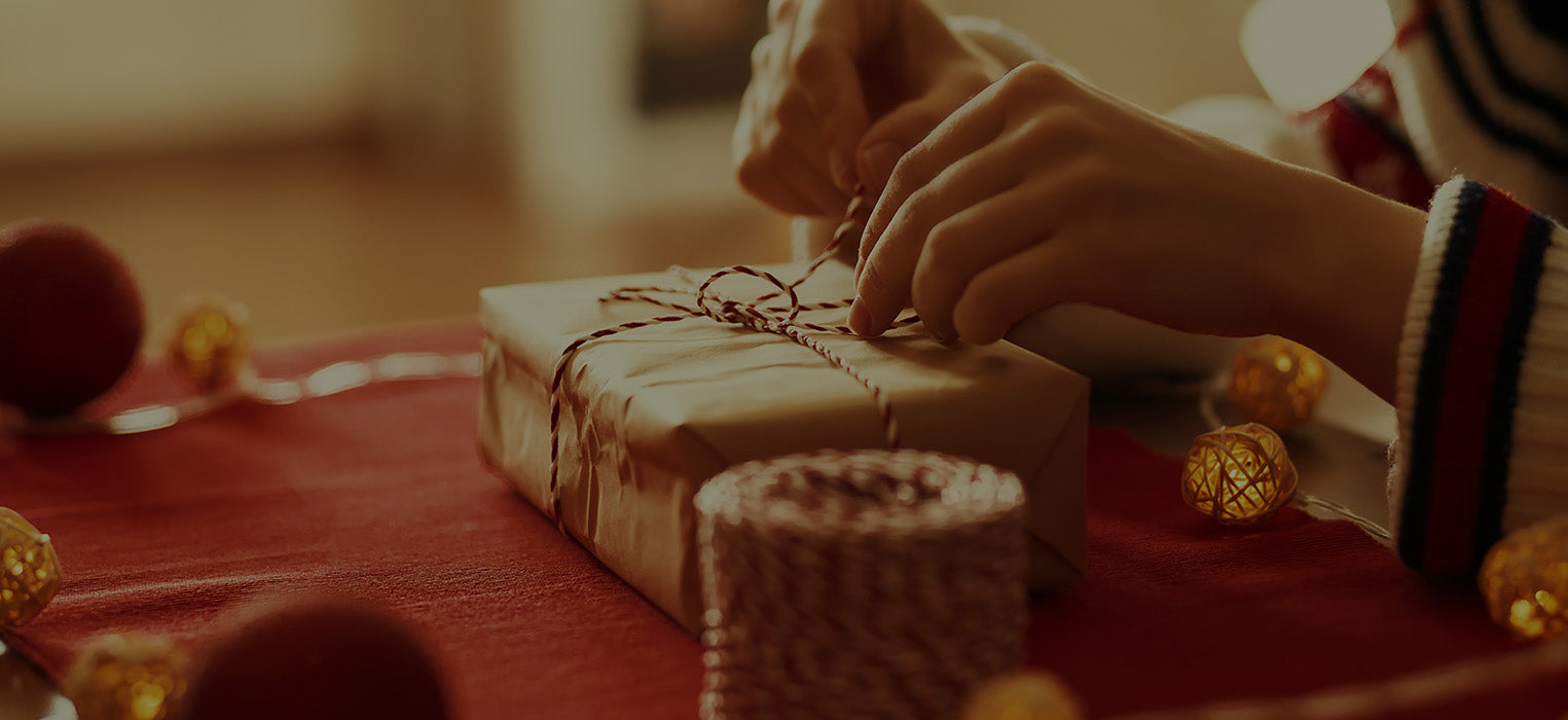 A person opening a New Year's gift